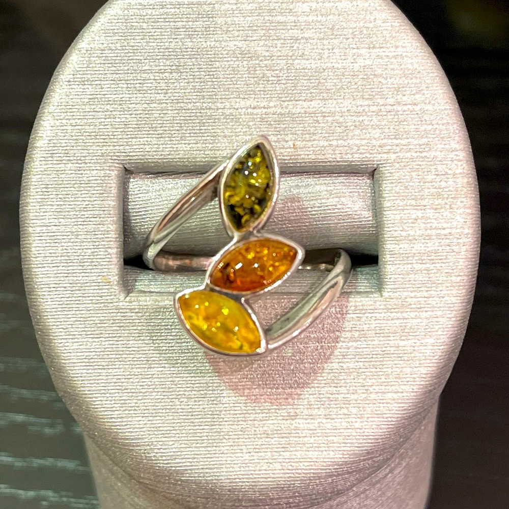.925 Amber ring with 3 marquise amber stones differing colors.